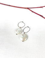 White coin pearl on silver patina wire hoop