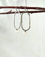 White pearl with hammered oblong silver earrings